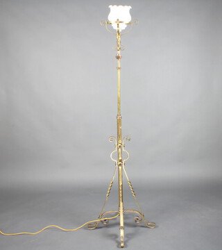 A Victorian wrought brass standard oil lamp on a cruciform base converted to electricity  166cm h 
