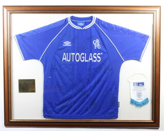 A Chelsea Football Club signed football shirt as worn in the 2000 FA Cup final, when Chelsea beat Aston Villa 1-0, signed by the team including Ed de Goey, Frank Leboeuf, Gustavo Poyet, Dennis Wise, Gianfranco Zola, etc, framed with brass plaque and Football Association commemorative pennant 