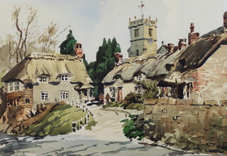 Josiah John Sturgeon (1919-2000), watercolour signed, a village scene with church and figures, Godshill, Isle of Wight, 34cm x 50cm 
