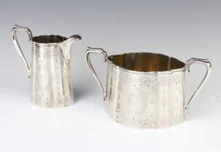 A Victorian engraved silver cream jug and sugar bowl, London 1867, 538 grams 