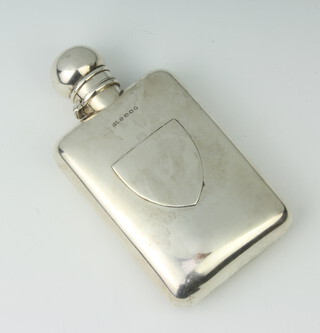 A Victorian silver hip flask with shield shaped vacant cartouche Birmingham 1887, 126 grams 