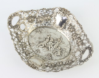 A Continental 800 standard shaped repousse dish decorated with cavorting cherubs surrounded by flowers 21cm, 240 grams 