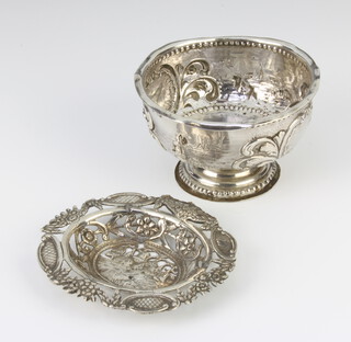 A repousse silver pedestal bowl with import marks together with a ditto shallow dish 109 grams 