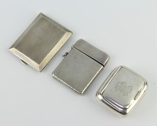 A silver rounded rectangular snuff box with engraved monogram, Birmingham 1945, 5cm, 2 match holders, 93 grams  