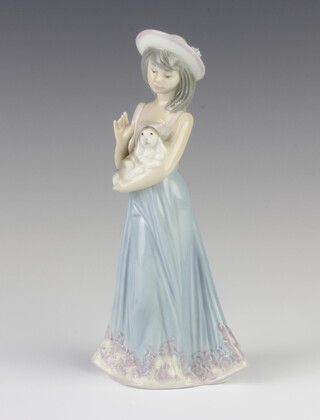 A Lladro figure of a girl holding a puppy 5645, 21cm