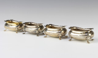 A set of 4 Edwardian silver table salts of rounded rectangular form on pad feet, Birmingham 1902, 170 grams 