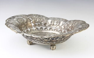 A Continental 800 standard oval pierced and repousse dish decorated with stylised flowers, 33.5 cm, 659 grams