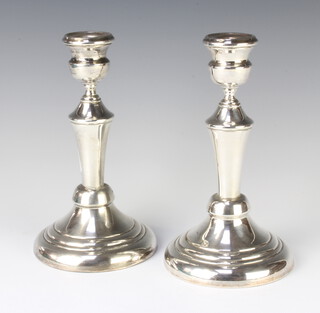A pair of Continental tapered silver candlesticks 21cm, 415 grams