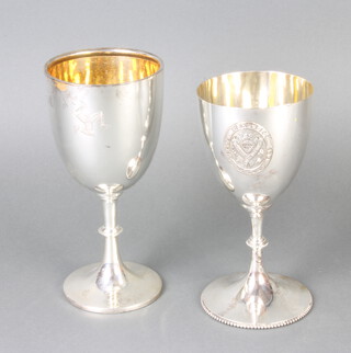 An Edwardian silver presentation cup Sheffield 1904, a large plain ditto with rubbed marks, 430 grams 