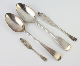 A Victorian silver table spoon, rubbed marks, 1 other and 2 butter knives 