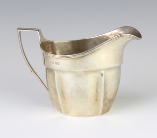 A George III silver cream jug with chased monogram London 1803, 179 grams 