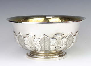 A Sterling silver repousse punch bowl decorated with acanthus leaves and with gilt interior, 24.5 cm, 729 grams