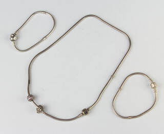 A silver Pandora necklace and 2 bracelets, 64 grams