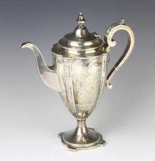 A 19th Century silver coffee pot chased with swags, festoons and a vacant cartouche, with S scroll handle and acanthus thumb piece, 760 grams gross 