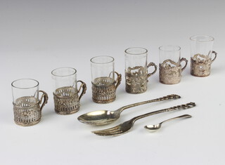 A set of 3 silver tots with matched glass liners, and 3 other silver tot holders with glass liners together with  3 silver spoons and a fork 146 grams 