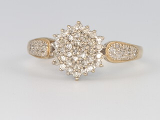 A 9ct yellow gold diamond cluster ring, size W, 3.6 grams