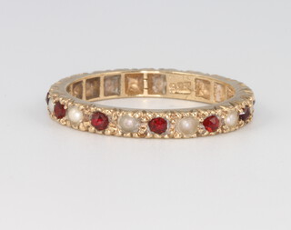 A 9ct yellow gold ruby and pearl eternity ring size L, 1.9 grams