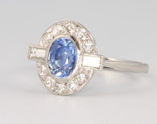 A platinum oval sapphire and diamond cluster ring, the centre stone approx. 1.2ct, the baguette and brilliant cut diamonds approx. 0.45ct, size N