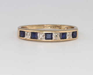 A 9ct yellow gold sapphire and diamond half eternity ring, size L 1/2, 1.6 grams