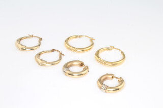 Three pairs of 9ct yellow gold half hoop earrings 6.3 grams 