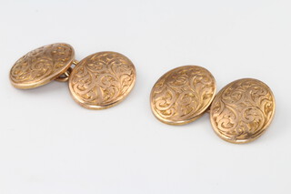 A pair of 9ct yellow gold engraved oval cufflinks 7.9 grams