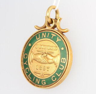 A 9ct yellow gold enamelled bicycle fob - Unity Cycling Club, founded 1887, 11.5 grams