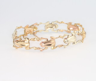 A 9ct 2 colour gold frog bracelet, set with ruby eyes, 22.8 grams