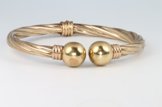 A 9ct yellow gold sprung torque bracelet, gross 10.5 grams 