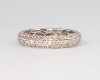 A 9ct white gold diamond set band, size I, 1.9 grams