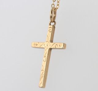 A 9ct yellow gold engraved cross and chain 2.3 grams 