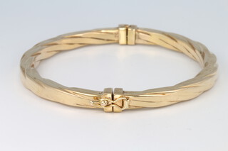 A 9ct yellow gold oval bangle 8.5 grams
