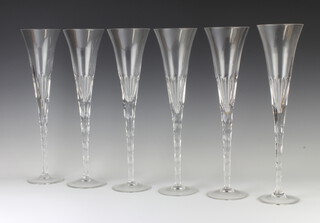A set of 6 Renwick and Clarke champagne flutes 34cm h 