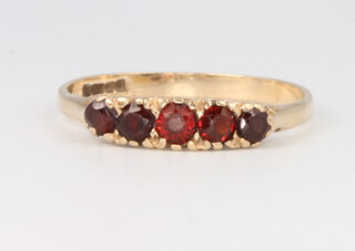 A 9ct yellow gold garnet ring size R, 1.9 grams