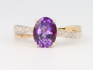 A 9ct yellow gold amethyst and diamond ring size P, 2.5 grams