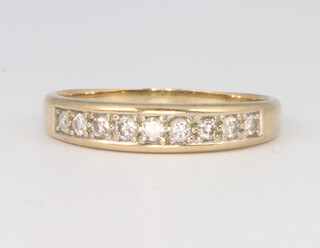 A 9ct yellow gold diamond ring size P, 2 grams