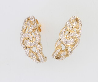 A pair of 9ct yellow gold diamond earrings 4.9 grams