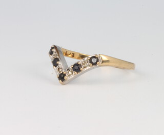 A 9ct yellow gold sapphire and diamond wishbone ring size N, 1.6 grams