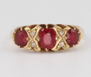 An 18ct yellow gold ruby and diamond ring size L, 3.2 grams