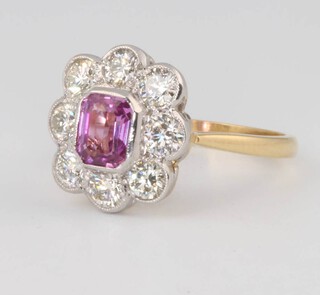 An 18ct yellow gold pink sapphire and diamond cluster ring, the centre stone approx. 1.1ct surrounded by brilliant cut diamonds approx. 1.2ct, size O 