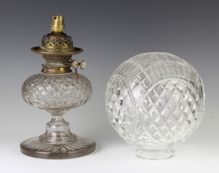 An Edwardian cut glass oil lamp with spherical shade and circular base 46cm 