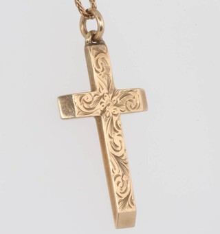 A 9ct yellow gold engraved cross on a ditto chain 5.4 grams 