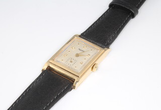 A gentleman's 9ct yellow gold Rotary wristwatch with seconds at 6 o'clock contained in a tonneau case 35mm x 22mm 
