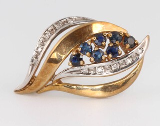 A 9ct yellow gold sapphire and diamond scroll brooch, 30mm 