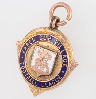 A 9ct yellow gold enamelled football fob 7.7 grams