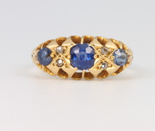 An 18ct yellow gold sapphire and diamond ring, size m 1/2, 3.8 grams