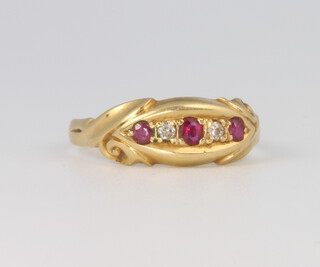 An 18ct yellow gold ruby and diamond ring size L, 2.2 grams