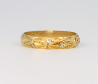 An 18ct yellow gold diamond ring, size L 1/2, 2.5 grams