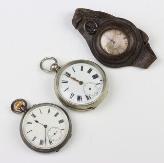 A silver cased mechanical pocket watch with seconds at 6 o'clock, a keywind ditto and a silver wristwatch with a leather enclosed strap 