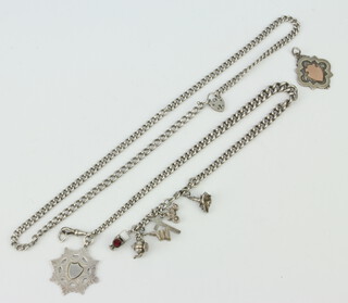 A silver Albert with fob and charms, a silver necklace and a loose fob, 130 grams