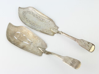 A George IV silver fiddle pattern fish slice engraved with a fish together with a Georgian ditto with rubbed marks, 248 grams